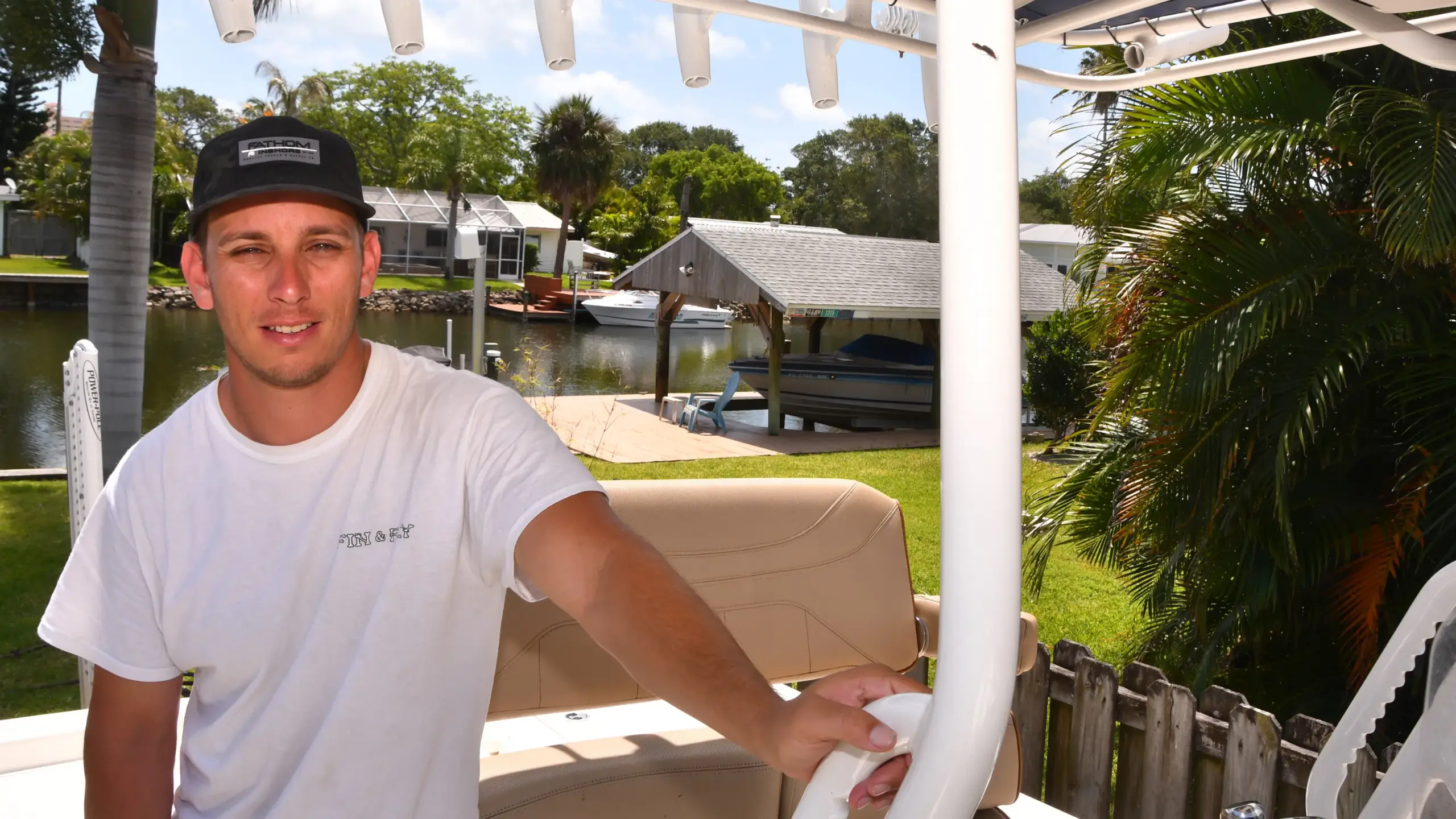 Captain Jamie Glasner at the helm of the Cocoa Beach Eco Tours pontoon boat